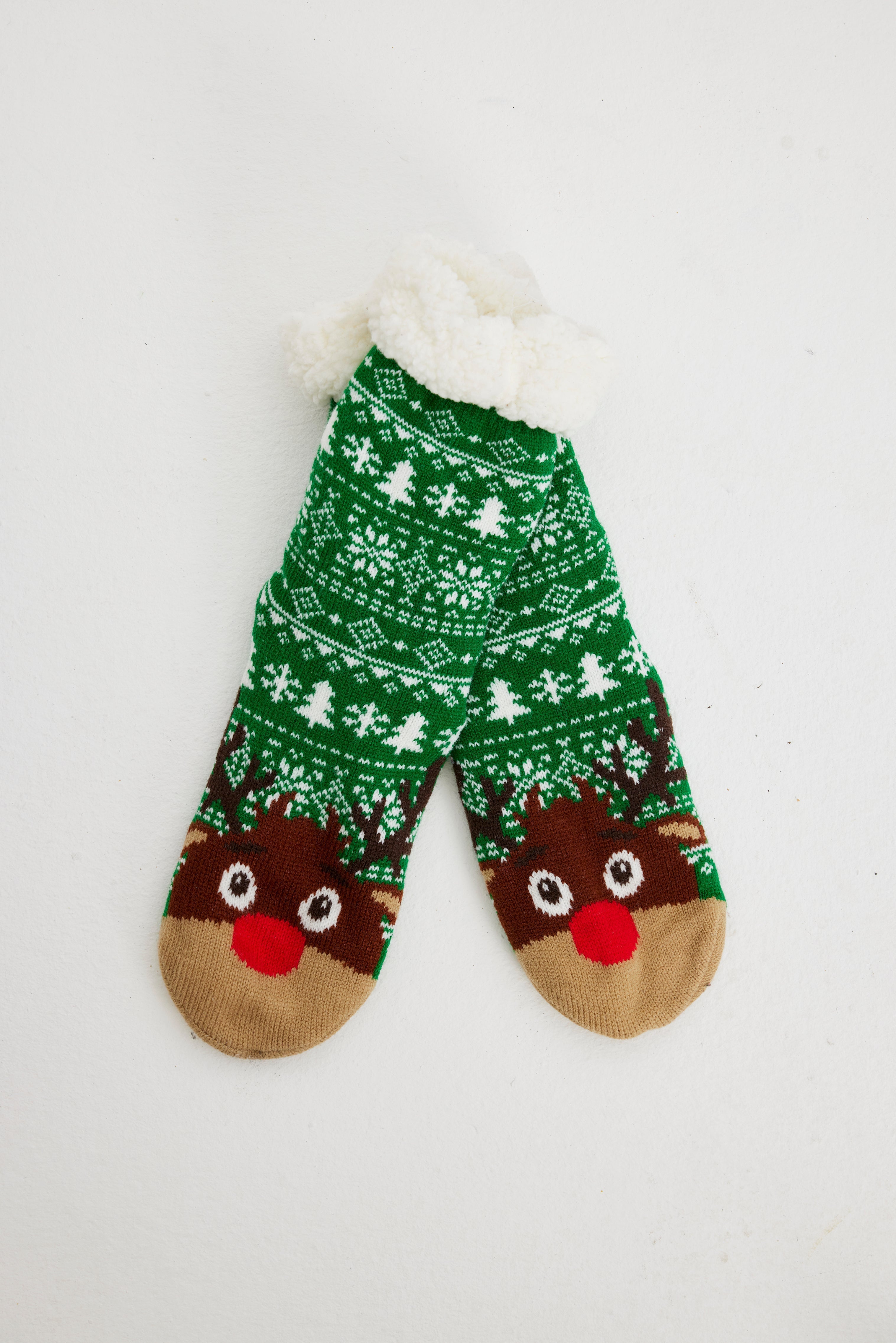 Gröna julstrumpor med renar på.