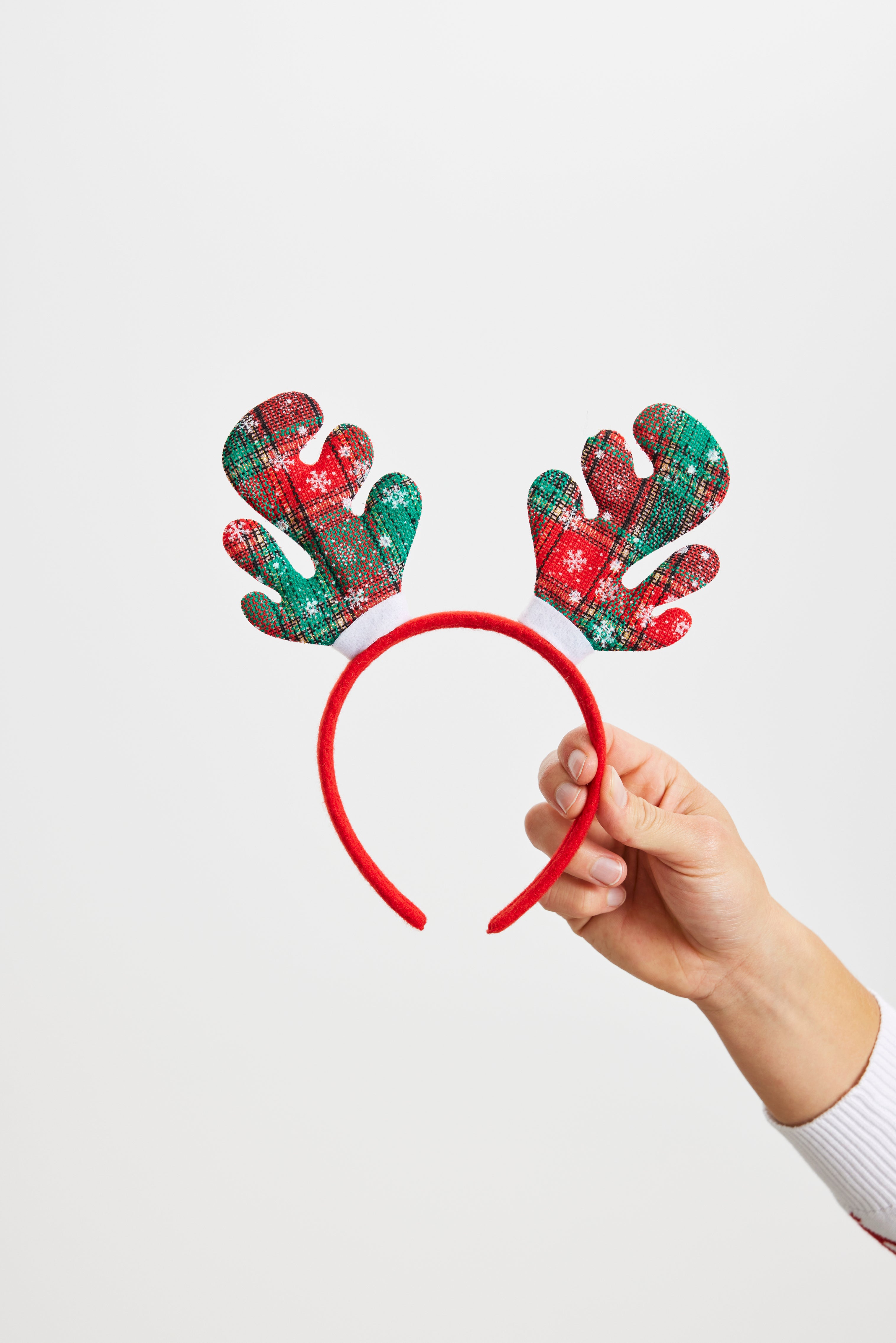 En röd och grön hårinpackning som liknar renhorn.