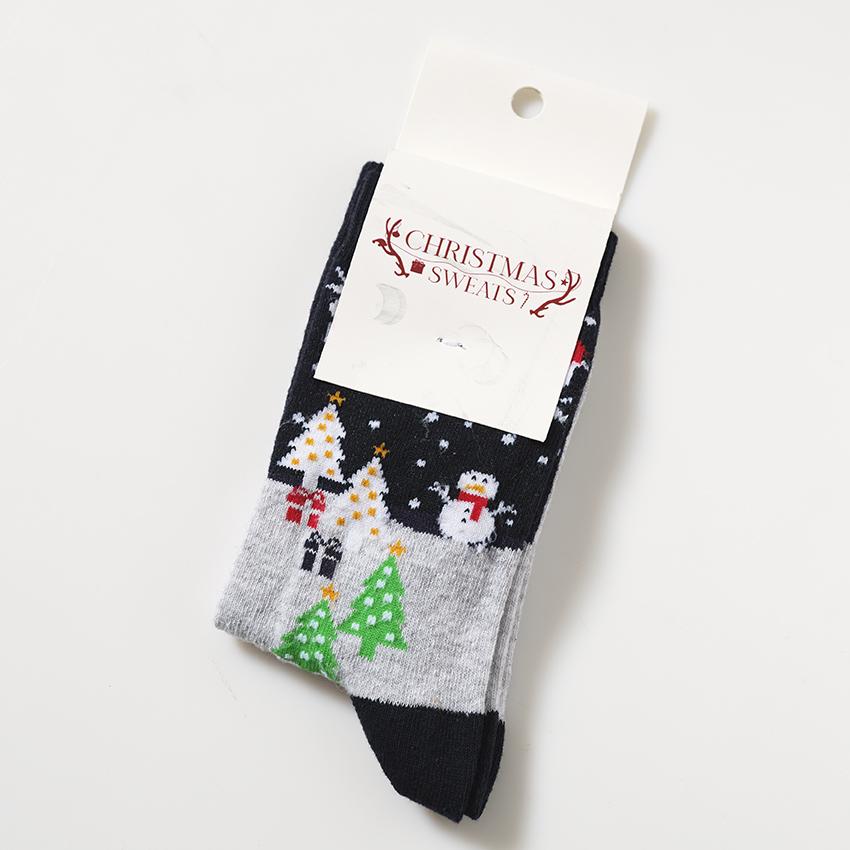 Julstrumpor med snölandskap på.